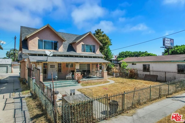 rear view of house with a patio and a garage