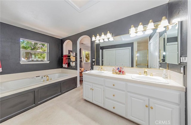 46469 Wallu Ln, Ahwahnee, CA 93601 - bathroom with a bath, a sink, and a healthy amount of sunlight