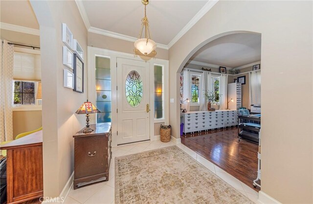 46469 Wallu Ln, Ahwahnee, CA 93601 - entryway with arched walkways, tile patterned flooring, and crown molding