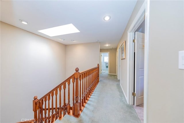 46469 Wallu Ln, Ahwahnee, CA 93601 - hall with baseboards, a skylight, an upstairs landing, and carpet