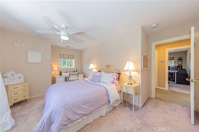 46469 Wallu Ln, Ahwahnee, CA 93601 - bedroom with light carpet, baseboards, visible vents, and ceiling fan