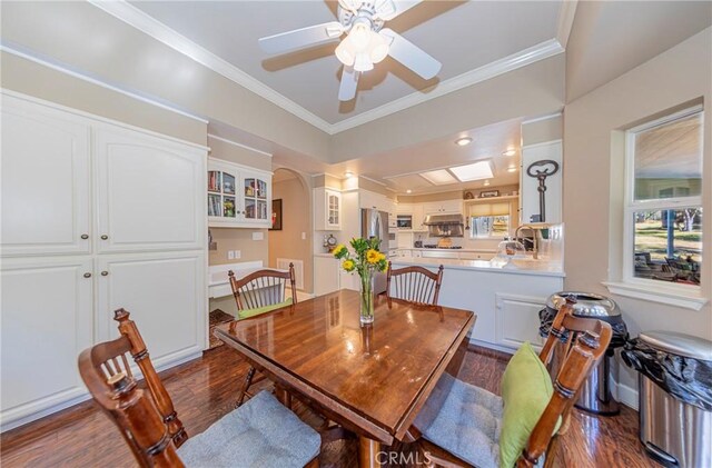 46469 Wallu Ln, Ahwahnee, CA 93601 - dining room featuring arched walkways, dark wood-style floors, ornamental molding, and ceiling fan