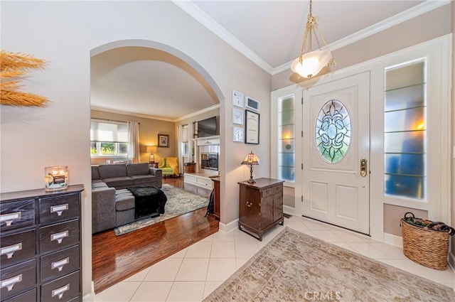 46469 Wallu Ln, Ahwahnee, CA 93601 - foyer with ornamental molding, light tile patterned floors, arched walkways, and baseboards