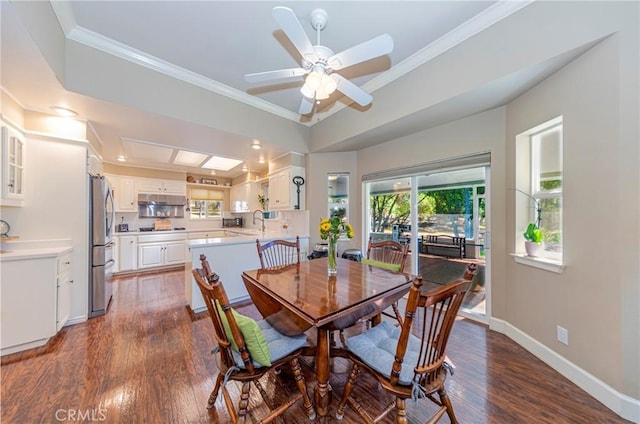 46469 Wallu Ln, Ahwahnee, CA 93601 - dining space with dark wood finished floors, baseboards, crown molding, and a ceiling fan