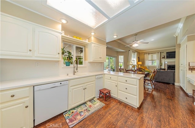 46469 Wallu Ln, Ahwahnee, CA 93601 - kitchen with ornamental molding, a sink, dark wood-style floors, a peninsula, and white dishwasher