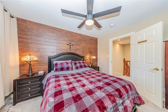 46469 Wallu Ln, Ahwahnee, CA 93601 - bedroom with a ceiling fan, an accent wall, wooden walls, and light carpet