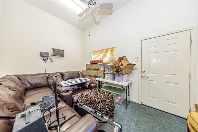 46469 Wallu Ln, Ahwahnee, CA 93601 - living room featuring a ceiling fan, a wall unit AC, lofted ceiling, baseboards, and carpet