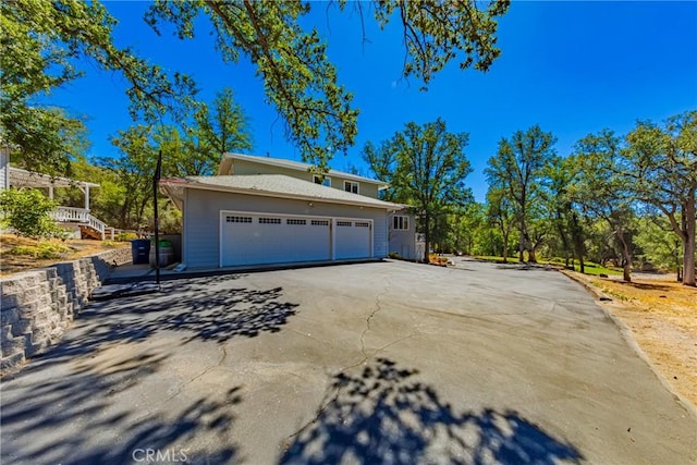 46469 Wallu Ln, Ahwahnee, CA 93601 - view of side of home with concrete driveway and a garage