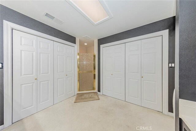 46469 Wallu Ln, Ahwahnee, CA 93601 - unfurnished bedroom featuring two closets and visible vents