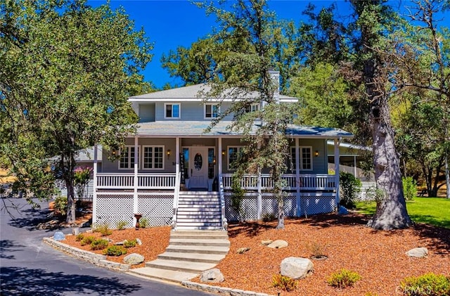 46469 Wallu Ln, Ahwahnee, CA 93601 - view of front of property with a porch, stairway, and roof with shingles