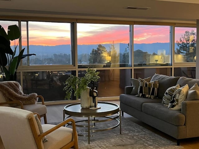 sunroom featuring a mountain view