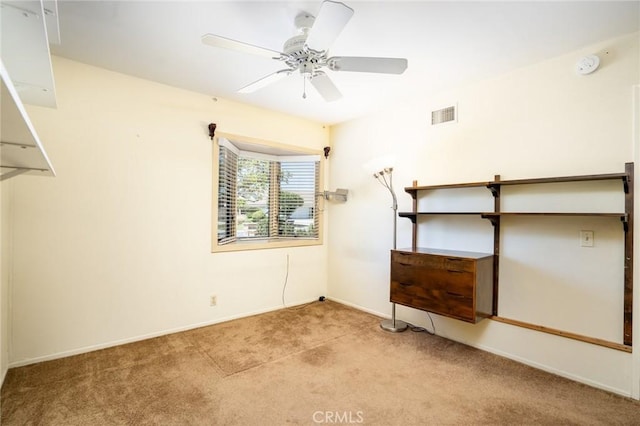 unfurnished bedroom with ceiling fan and light colored carpet