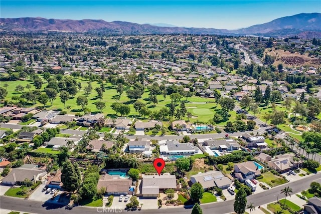 birds eye view of property with a mountain view