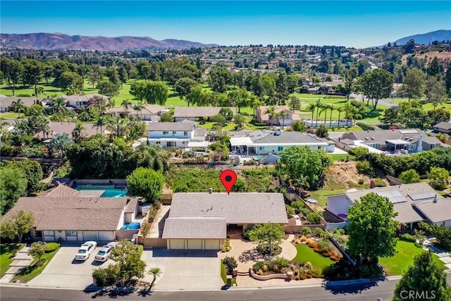 birds eye view of property featuring a mountain view