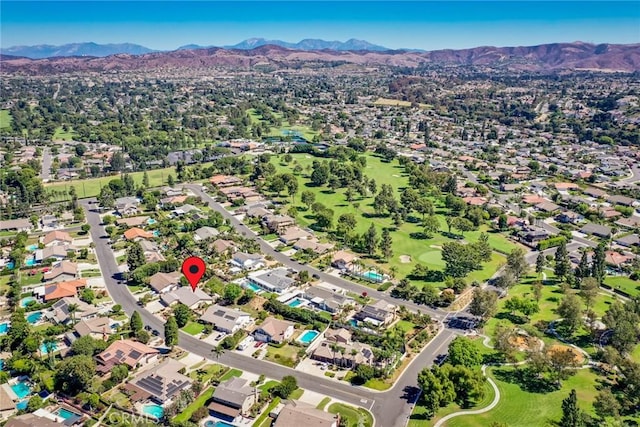 birds eye view of property featuring a mountain view