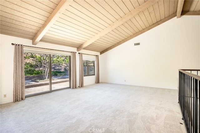 carpeted spare room with lofted ceiling with beams and wooden ceiling