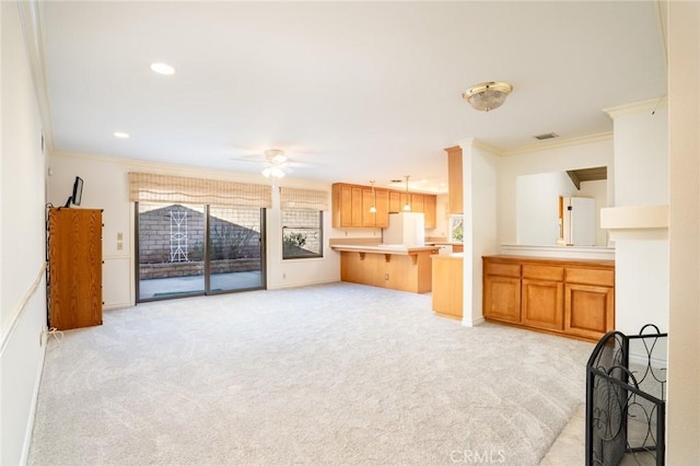 carpeted living room featuring ceiling fan and ornamental molding