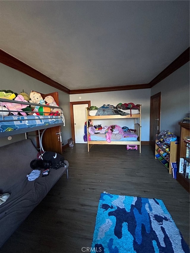 bedroom featuring dark hardwood / wood-style floors and crown molding