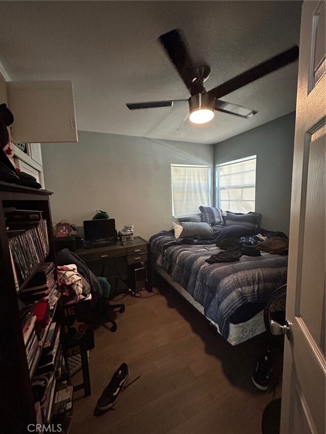 bedroom featuring ceiling fan and hardwood / wood-style flooring