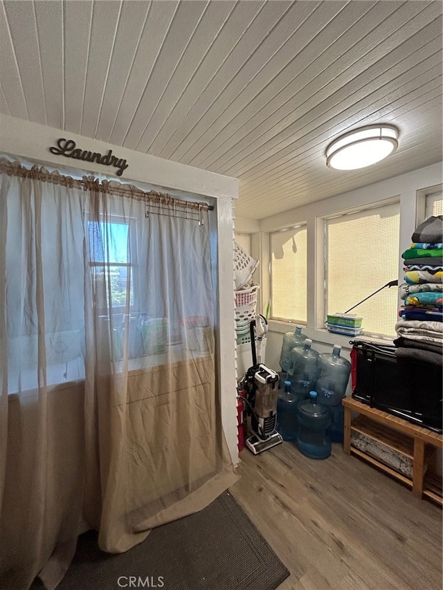 interior space with a healthy amount of sunlight and hardwood / wood-style floors