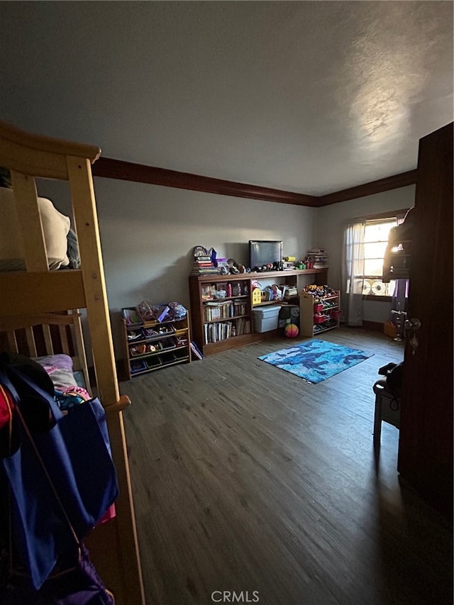 interior space with hardwood / wood-style floors and crown molding