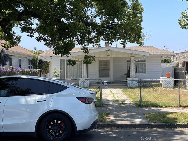 5426 La Mirada Ave, Los Angeles, CA 90029 - view of front of property featuring a gate, a fenced front yard, and covered porch