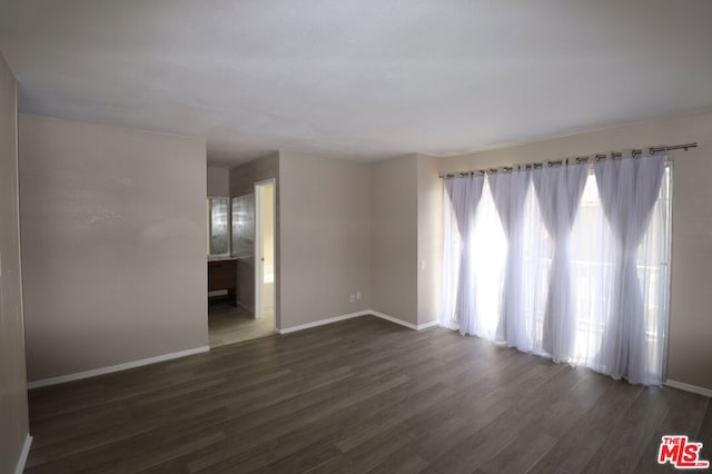 empty room featuring dark hardwood / wood-style floors