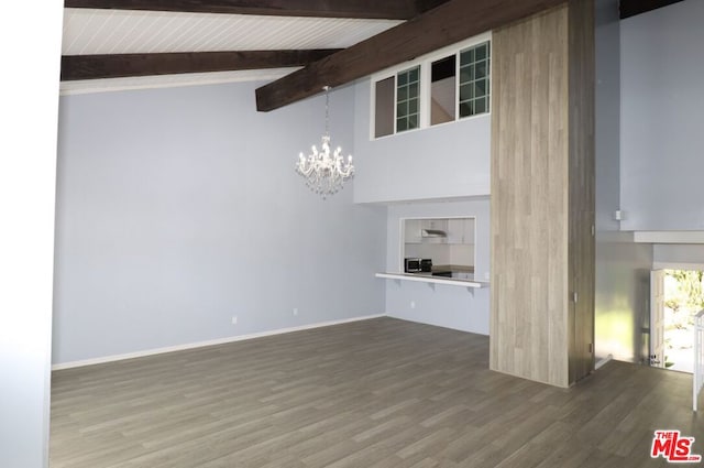 unfurnished living room with beamed ceiling, wood ceiling, a chandelier, high vaulted ceiling, and hardwood / wood-style floors