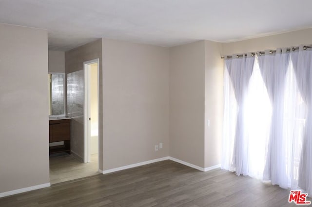 spare room featuring hardwood / wood-style floors