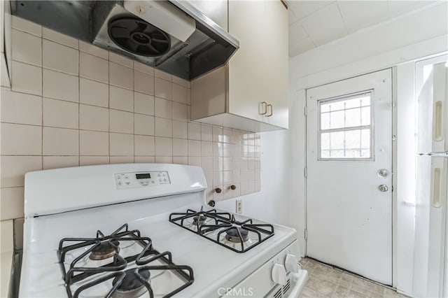 kitchen with range hood, tile walls, white range with gas stovetop, and tasteful backsplash