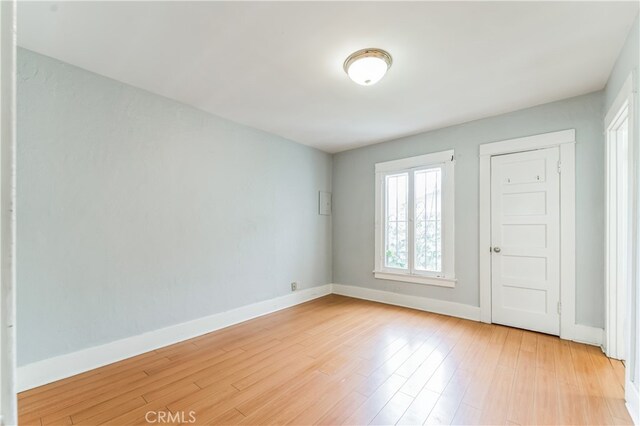 unfurnished room featuring light hardwood / wood-style floors