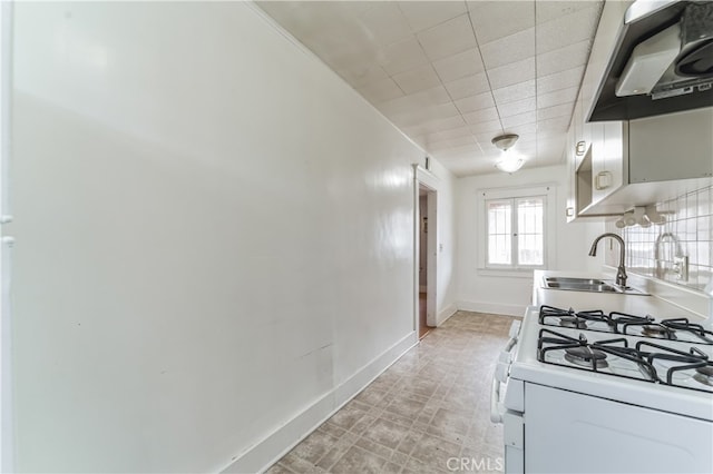 kitchen featuring white cabinetry, sink, exhaust hood, and white gas range oven