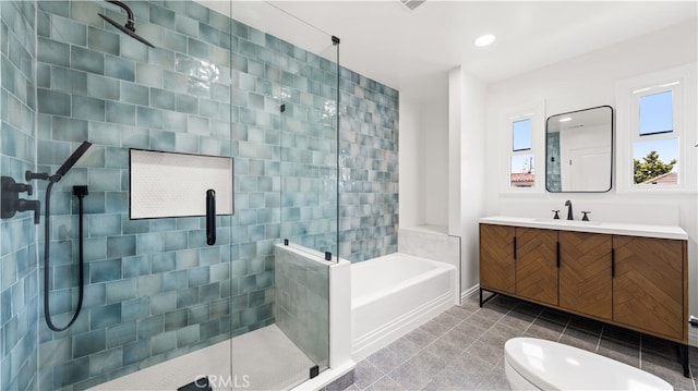 full bathroom featuring plus walk in shower, tile patterned flooring, vanity, and toilet