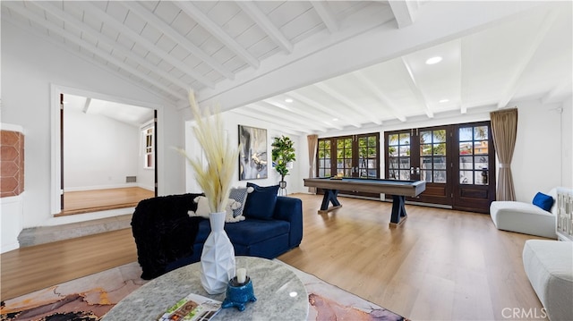 living room with lofted ceiling with beams, pool table, hardwood / wood-style floors, and french doors