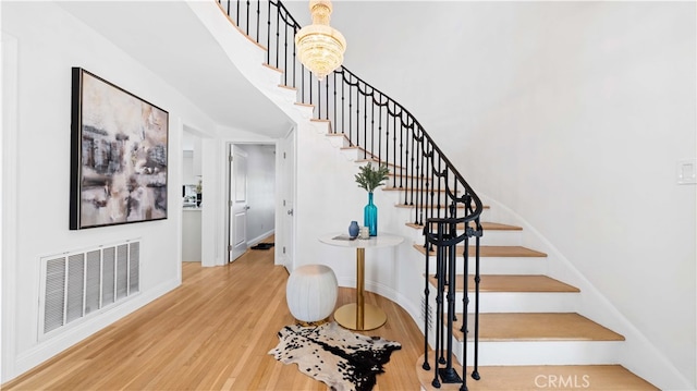 stairway featuring hardwood / wood-style flooring