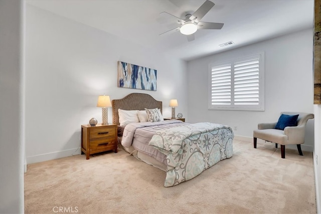 bedroom featuring ceiling fan and light carpet