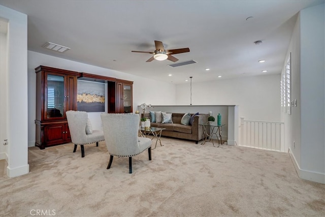 living room with ceiling fan and light carpet