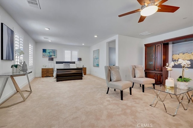 interior space featuring light carpet and ceiling fan