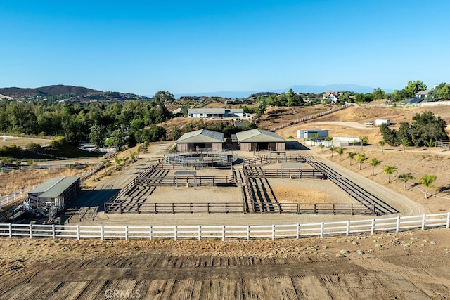 birds eye view of property with a mountain view and a rural view