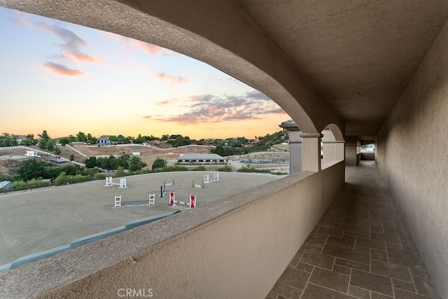 view of balcony at dusk