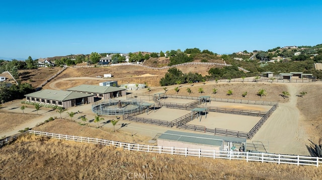 birds eye view of property with a rural view