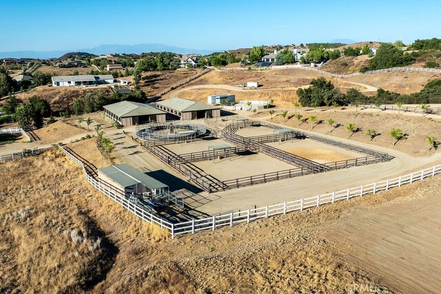 birds eye view of property featuring a rural view and a mountain view