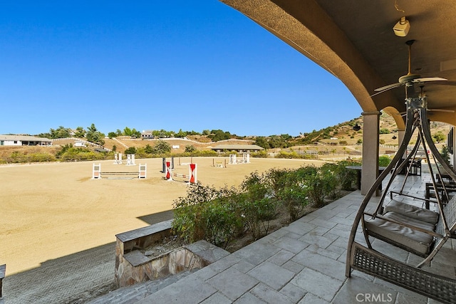 view of patio with ceiling fan