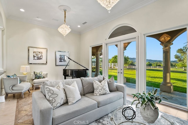 living room with french doors, crown molding, a notable chandelier, and light tile patterned flooring