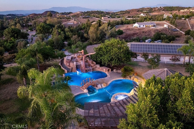 birds eye view of property featuring a mountain view