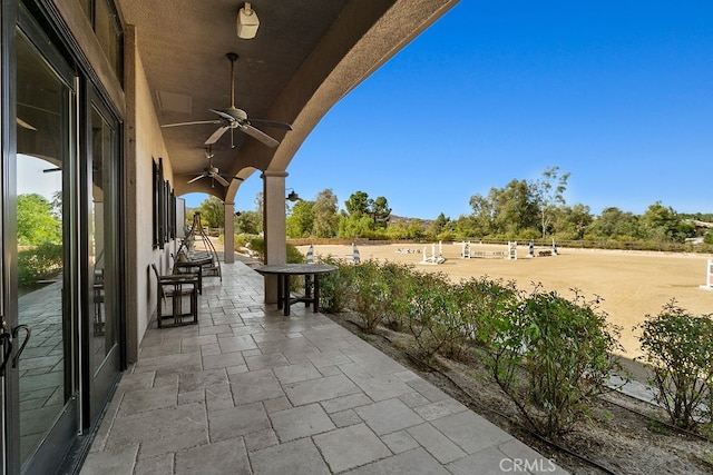 view of patio / terrace featuring ceiling fan