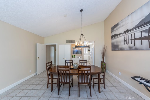 dining space with a chandelier, visible vents, vaulted ceiling, and baseboards