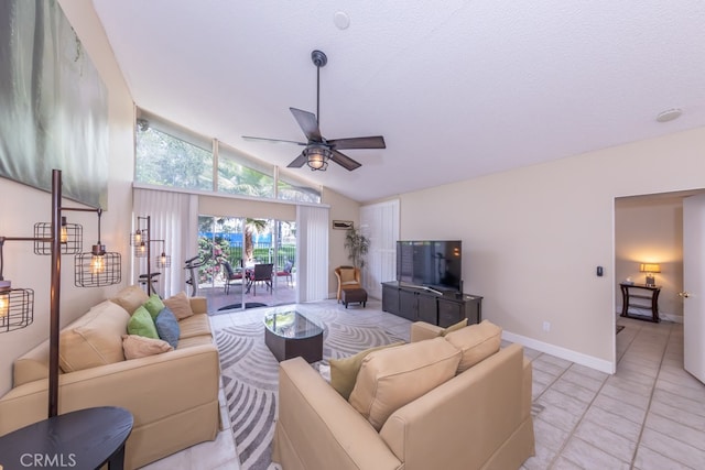 living area featuring a ceiling fan, lofted ceiling, baseboards, and light tile patterned floors