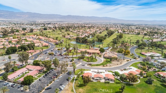 drone / aerial view featuring a residential view and a mountain view