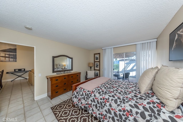 bedroom with light tile patterned floors, a textured ceiling, lofted ceiling, baseboards, and access to exterior